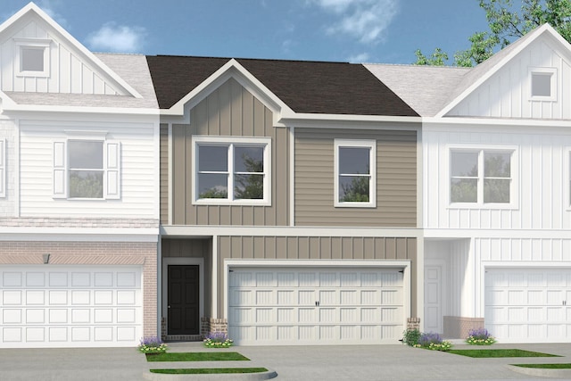 view of property with a garage and board and batten siding
