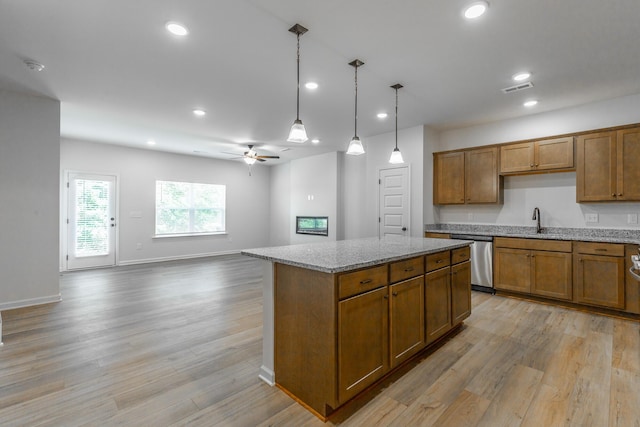 11304 Cape Vw, Soddy Daisy, TN 37379 - kitchen with dishwasher, brown cabinets, ceiling fan, light wood-style flooring, and recessed lighting