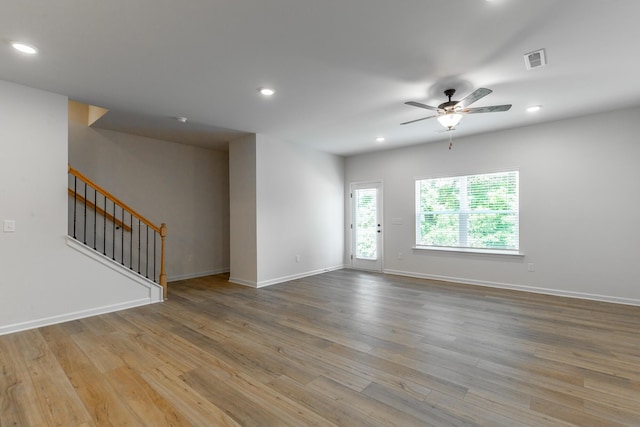 11304 Cape Vw, Soddy Daisy, TN 37379 - unfurnished room with stairway, recessed lighting, a ceiling fan, wood finished floors, and baseboards