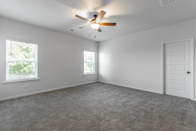 11304 Cape Vw, Soddy Daisy, TN 37379 - unfurnished room featuring a ceiling fan, dark colored carpet, and baseboards