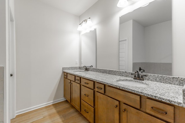 11304 Cape Vw, Soddy Daisy, TN 37379 - bathroom featuring wood finished floors, double vanity, and baseboards