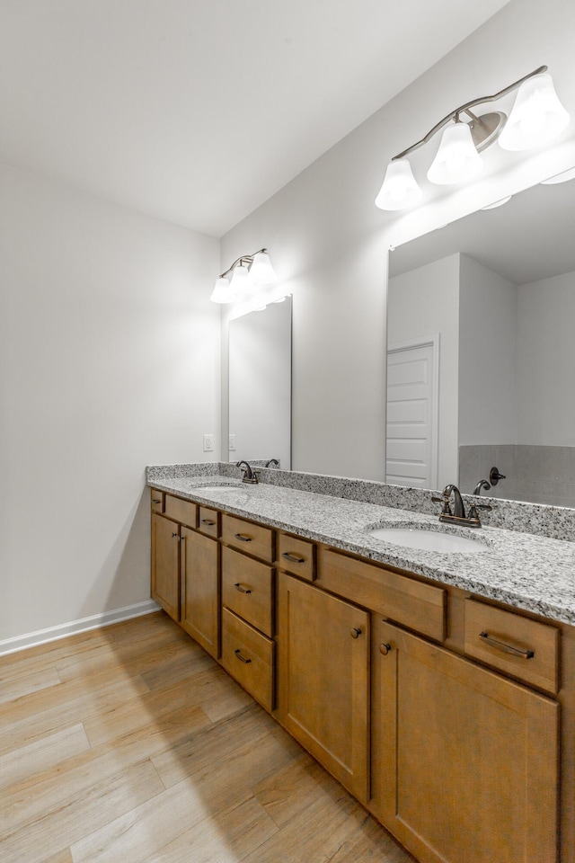11304 Cape Vw, Soddy Daisy, TN 37379 - full bathroom with wood finished floors, double vanity, and baseboards