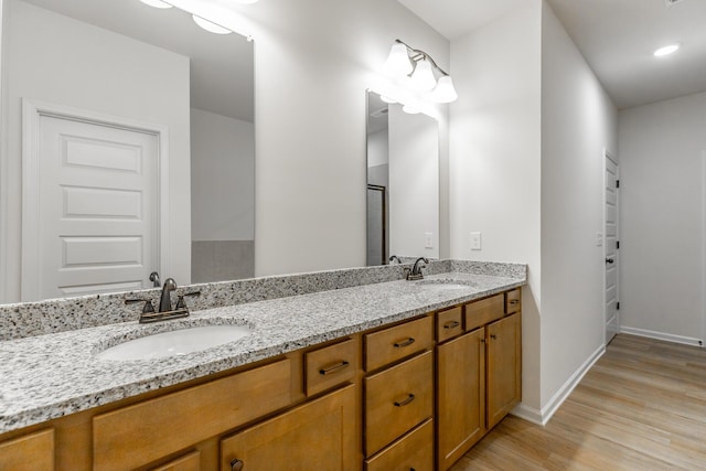 11304 Cape Vw, Soddy Daisy, TN 37379 - full bathroom featuring wood finished floors, double vanity, and baseboards