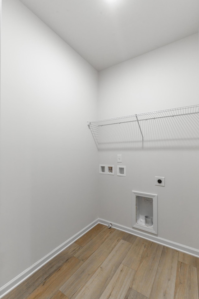 11304 Cape Vw, Soddy Daisy, TN 37379 - laundry room with wood finished floors, hookup for an electric dryer, baseboards, and washer hookup