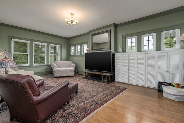 3308 Alta Vista Dr, Chattanooga, TN 37411 - living area featuring a notable chandelier, wood finished floors, and ornamental molding