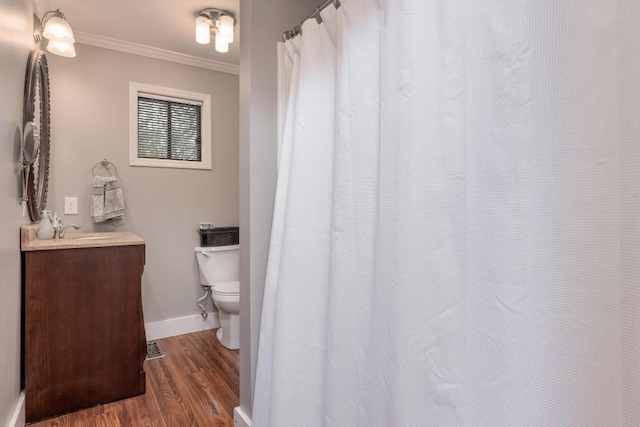3308 Alta Vista Dr, Chattanooga, TN 37411 - bathroom with vanity, crown molding, toilet, baseboards, and wood finished floors