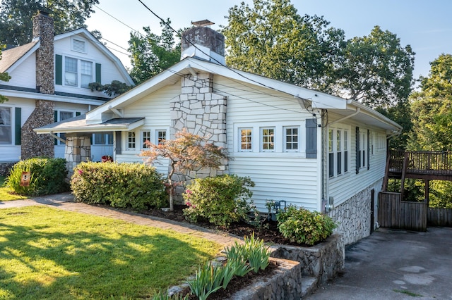 3308 Alta Vista Dr, Chattanooga, TN 37411 - view of front of home with a chimney, a front yard, and stone siding