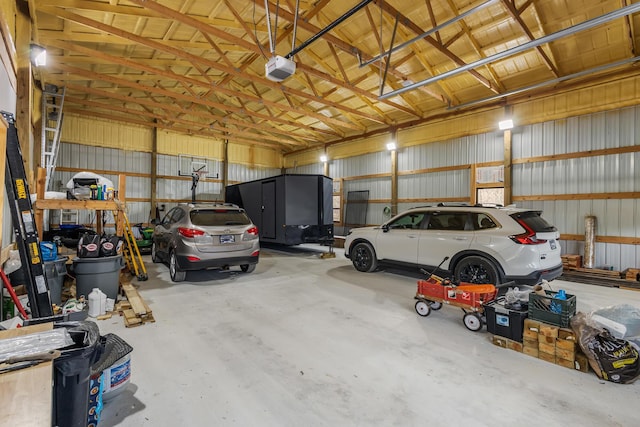 garage featuring metal wall and a garage door opener