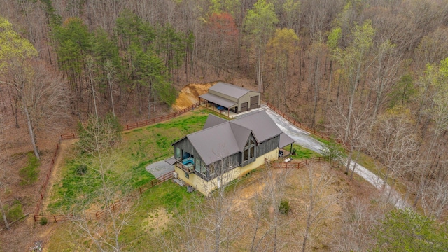 aerial view featuring a wooded view