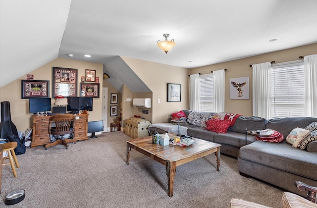 living area with carpet floors, a healthy amount of sunlight, and vaulted ceiling