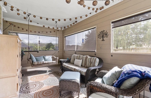 sunroom / solarium featuring outdoor lounge area
