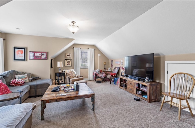 living area with carpet floors and vaulted ceiling