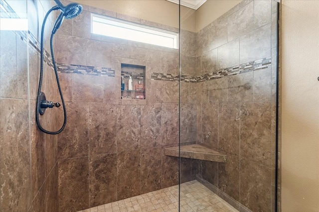 full bath with tiled shower