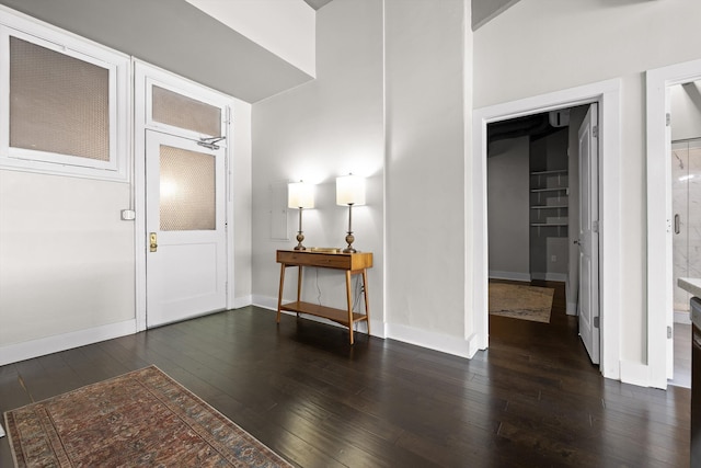 entrance foyer with hardwood / wood-style flooring and baseboards