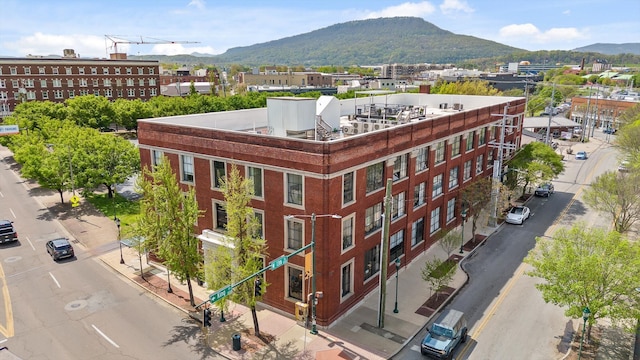 view of building exterior with a mountain view