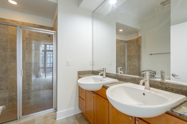 129 Walnut St # 122, Chattanooga, TN 37403 - full bath featuring a shower stall, tile patterned flooring, double vanity, and a sink