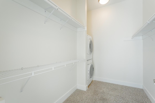 129 Walnut St # 122, Chattanooga, TN 37403 - walk in closet featuring stacked washer and clothes dryer and light carpet