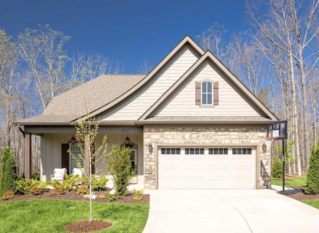 view of front of home featuring a shingled roof, stone siding, a garage, board and batten siding, and concrete driveway