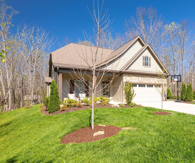 view of front of property featuring an attached garage, concrete driveway, and a front lawn