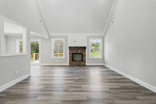 unfurnished living room featuring baseboards, high vaulted ceiling, dark wood-type flooring, and crown molding