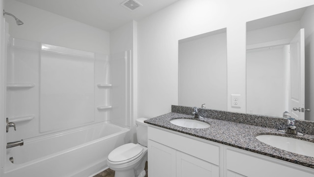 full bath featuring visible vents, a sink, toilet, and double vanity