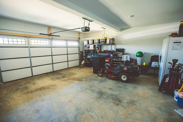 garage featuring a garage door opener