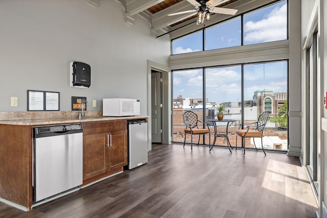 1467 Market St Unit 200, Chattanooga, TN 37402 - kitchen featuring stainless steel dishwasher, beam ceiling, ceiling fan, a high ceiling, and white microwave