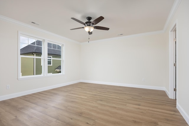 empty room with baseboards, light wood-type flooring, ornamental molding, and a ceiling fan