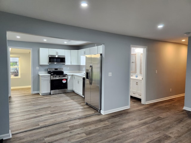 185 Carolina Ave, Delano, TN 37325 - kitchen featuring light wood-style flooring, recessed lighting, baseboards, and stainless steel appliances