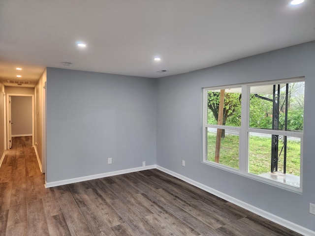 185 Carolina Ave, Delano, TN 37325 - empty room featuring dark wood-type flooring, baseboards, and recessed lighting