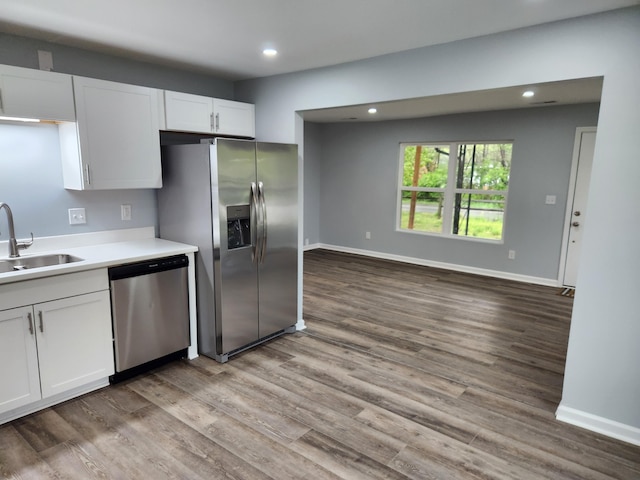 185 Carolina Ave, Delano, TN 37325 - kitchen with a sink, white cabinets, wood finished floors, and stainless steel appliances