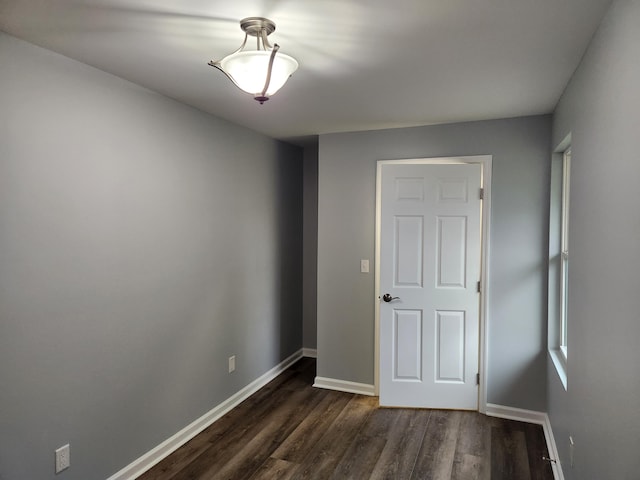 185 Carolina Ave, Delano, TN 37325 - empty room featuring dark wood-style flooring and baseboards