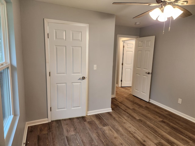 185 Carolina Ave, Delano, TN 37325 - unfurnished bedroom featuring dark wood-style flooring, baseboards, and ceiling fan