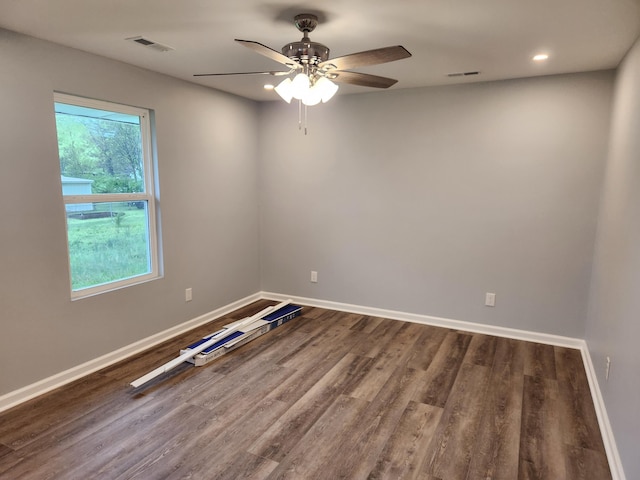 185 Carolina Ave, Delano, TN 37325 - spare room featuring visible vents, baseboards, wood finished floors, and ceiling fan