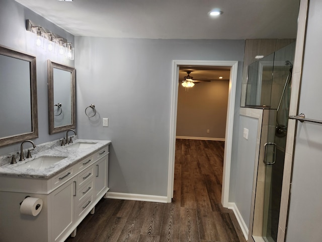 185 Carolina Ave, Delano, TN 37325 - full bath with a sink, baseboards, a shower stall, and wood finished floors