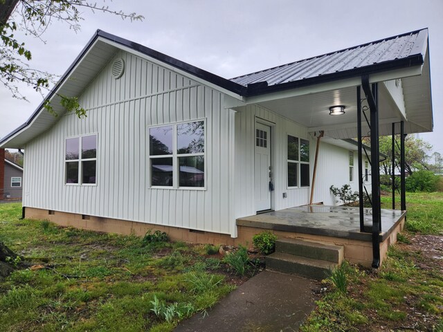 185 Carolina Ave, Delano, TN 37325 - exterior space with crawl space, board and batten siding, covered porch, and metal roof