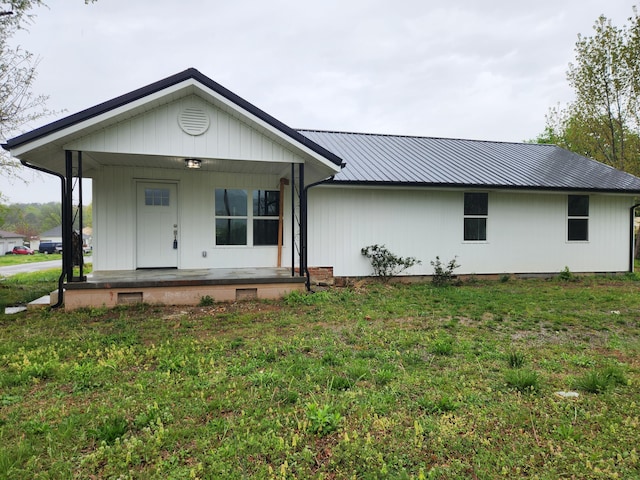 185 Carolina Ave, Delano, TN 37325 - view of front facade with metal roof, a front lawn, and covered porch