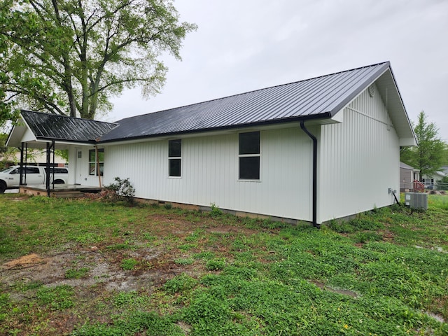 185 Carolina Ave, Delano, TN 37325 - rear view of property with a yard, metal roof, and central AC unit