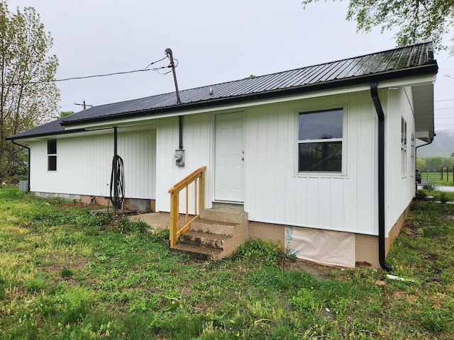 185 Carolina Ave, Delano, TN 37325 - back of house featuring metal roof and entry steps