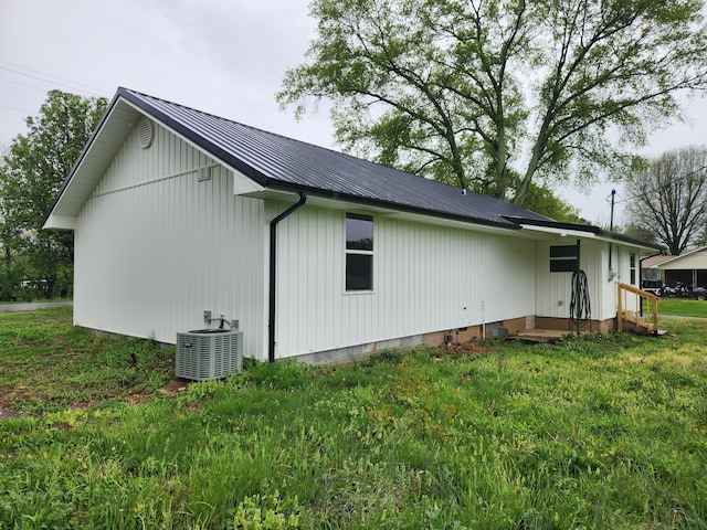 185 Carolina Ave, Delano, TN 37325 - view of home's exterior featuring a yard, metal roof, and central air condition unit