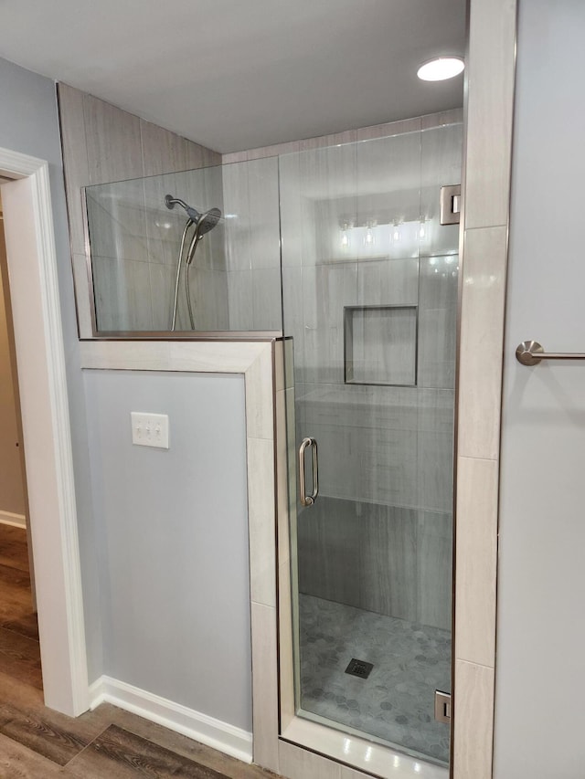 185 Carolina Ave, Delano, TN 37325 - bathroom featuring a shower stall, wood finished floors, and baseboards
