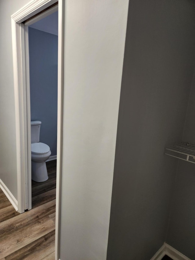 185 Carolina Ave, Delano, TN 37325 - bathroom with baseboards, toilet, and wood finished floors