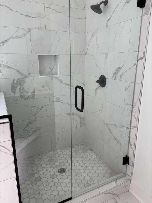 bathroom featuring a stall shower