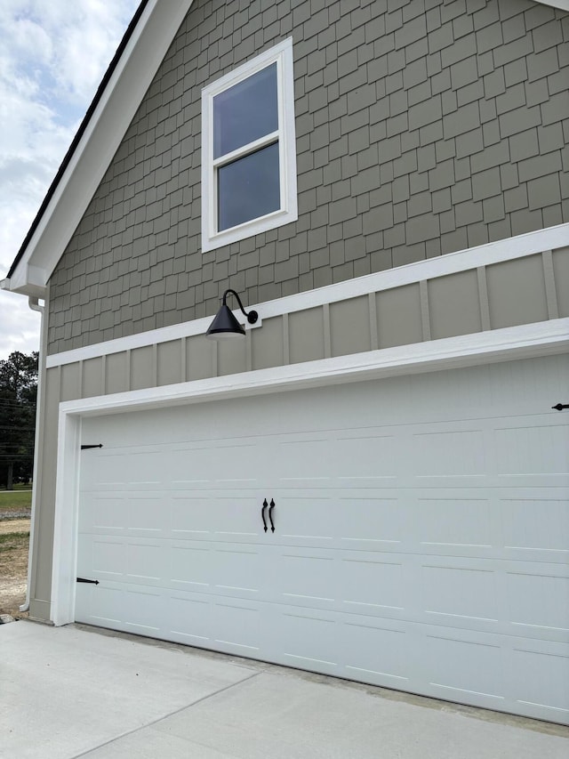garage with concrete driveway