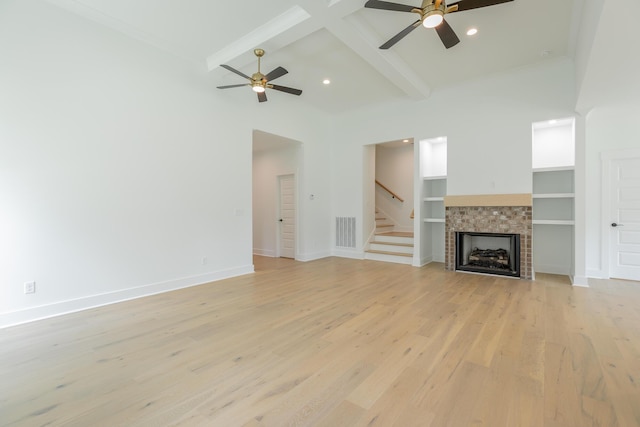 9532 N Valley Trl, Ooltewah, TN 37363 - unfurnished living room with ceiling fan, beamed ceiling, light wood-style flooring, stairway, and baseboards