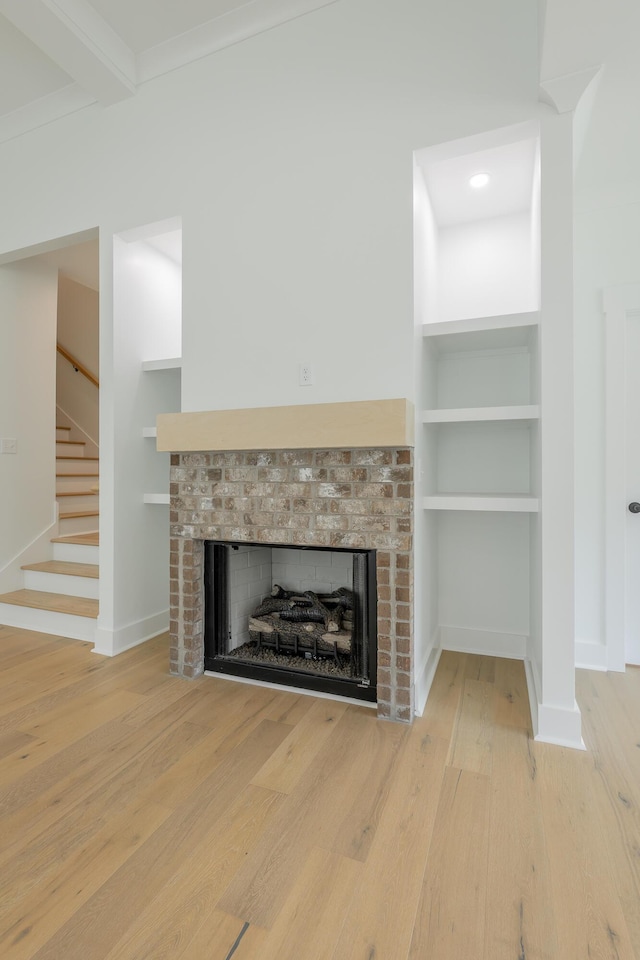 9532 N Valley Trl, Ooltewah, TN 37363 - detailed view of a fireplace, wood finished floors, and baseboards