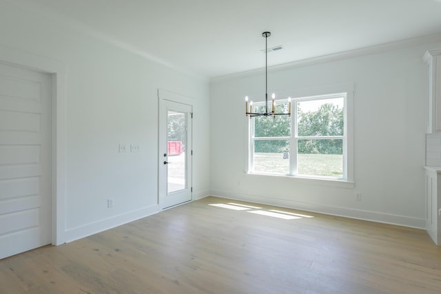9532 N Valley Trl, Ooltewah, TN 37363 - spare room featuring light wood-style flooring, a chandelier, healthy amount of natural light, and baseboards