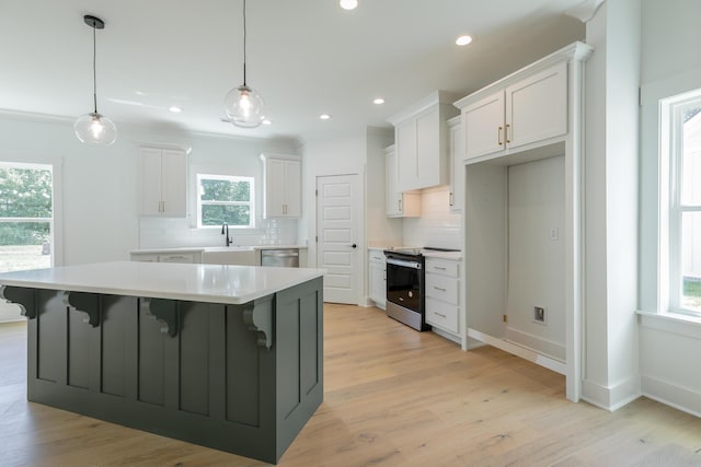 9532 N Valley Trl, Ooltewah, TN 37363 - kitchen featuring appliances with stainless steel finishes, a sink, tasteful backsplash, light countertops, and white cabinetry