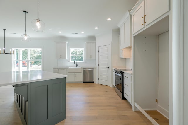 9532 N Valley Trl, Ooltewah, TN 37363 - kitchen with appliances with stainless steel finishes, backsplash, light wood finished floors, light countertops, and white cabinetry