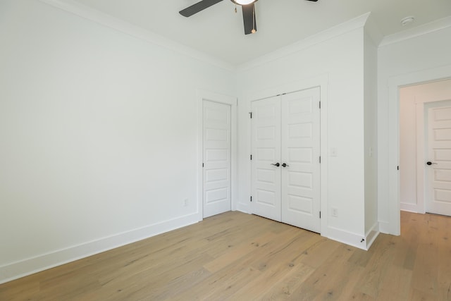 9532 N Valley Trl, Ooltewah, TN 37363 - unfurnished bedroom featuring crown molding, light wood-style floors, baseboards, a closet, and a ceiling fan